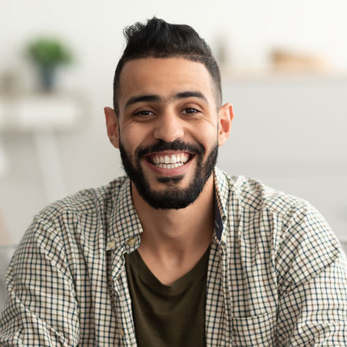 testi-portrait-of-handsome-young-arab-man-smiling-and-l.jpg